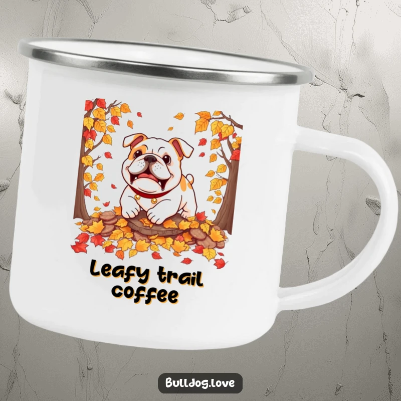 Funny bulldog camping mug with a dog playfully pouncing on autumn leaves, ready for fall adventures.