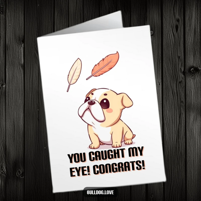 Free printable congratulations card of a bulldog gazing upwards with total adoration at a gently floating feather.