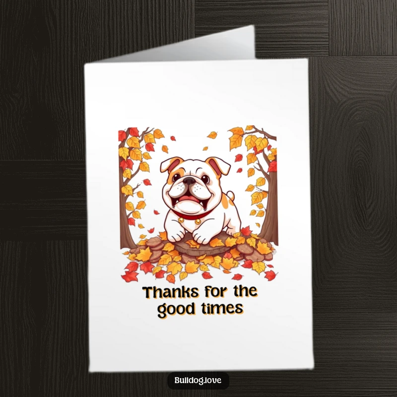 Funny Free Printable Thank You Card: A bulldog joyfully pouncing into a pile of autumn leaves, conveying playful gratitude.